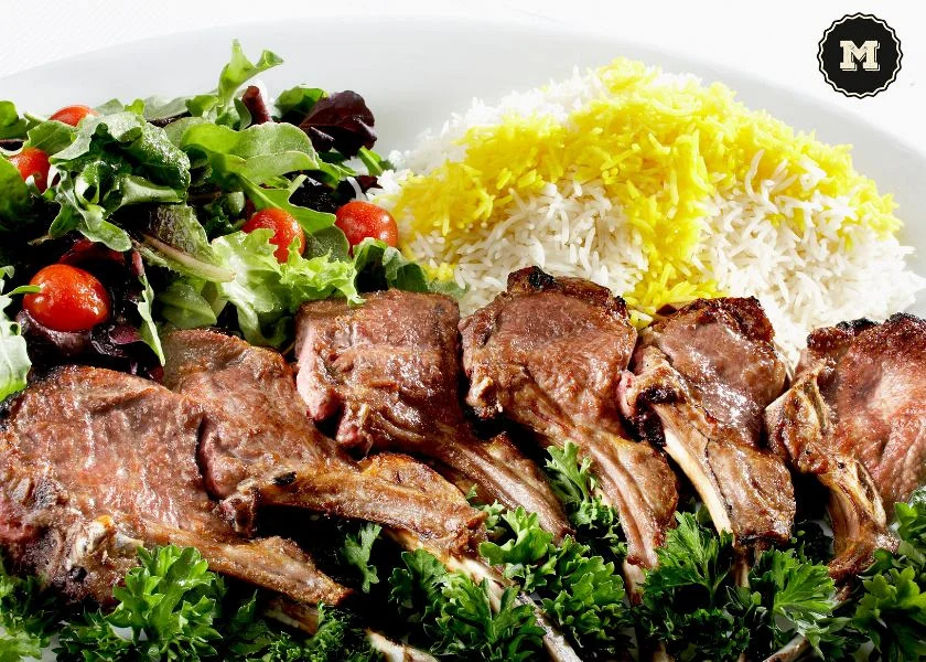 Lamb roasted in a wood-fired oven with salad and rice Lamb roasted in a wood-fired oven with salad and rice